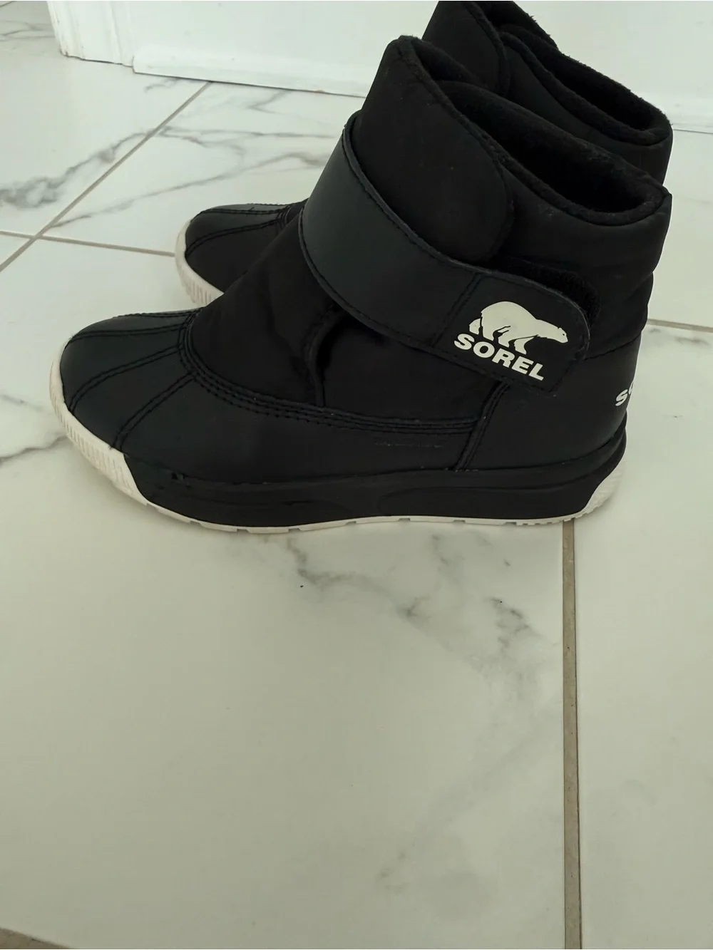 Sorel Kids Black Slip-On Winter Boots with White Sole